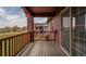 Charming balcony showcasing wood railings and siding, offering a serene outdoor retreat with scenic neighborhood views at 2552 W 82Nd Ln # C, Westminster, CO 80031