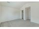 This bedroom features neutral walls, gray carpet, and a closet for ample storage at 2552 W 82Nd Ln # C, Westminster, CO 80031