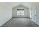 This bedroom features neutral walls, gray carpet, and a large window with blinds at 2552 W 82Nd Ln # C, Westminster, CO 80031