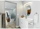 Well-lit half bath with updated fixtures, a modern sink, and a sleek vanity at 2658 S Xanadu Way # B, Aurora, CO 80014