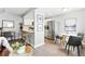 Open concept kitchen with breakfast bar, stainless steel appliances, and adjacent breakfast nook at 2658 S Xanadu Way # B, Aurora, CO 80014