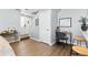 An open living area with modern flooring, a cozy desk nook, and neutral-toned walls offering a versatile space at 2658 S Xanadu Way # B, Aurora, CO 80014