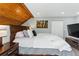 Bedroom showcases a wood ceiling and artistic wall decor at 2658 S Xanadu Way # B, Aurora, CO 80014