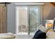 Main bedroom includes a balcony with seating and a view at 2658 S Xanadu Way # B, Aurora, CO 80014