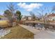 Picturesque community pond featuring a charming bridge, lush landscaping, and tranquil water at 2658 S Xanadu Way # B, Aurora, CO 80014