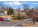 Exterior view of community with pond, landscaping, and convenient parking area at 2658 S Xanadu Way # B, Aurora, CO 80014