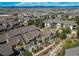 Aerial view of townhomes with landscaping and mountain views in the background at 535 Lost Valley Pt, Castle Rock, CO 80108