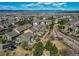 Aerial view of townhomes with landscaping and mountain views in the background at 535 Lost Valley Pt, Castle Rock, CO 80108