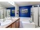 Bright bathroom features double sinks, soaking tub, and glass-enclosed shower at 535 Lost Valley Pt, Castle Rock, CO 80108