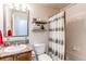 Bathroom boasts a shower-tub, vanity with countertop, and decorative shelving at 535 Lost Valley Pt, Castle Rock, CO 80108