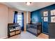 Bedroom featuring a dark wood crib and changing table at 535 Lost Valley Pt, Castle Rock, CO 80108