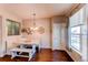 Dining nook featuring bench seating, hardwood floors, and natural light at 535 Lost Valley Pt, Castle Rock, CO 80108