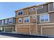 Townhome exterior with attached garages and neutral color scheme at 535 Lost Valley Pt, Castle Rock, CO 80108