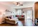 Comfortable living room featuring wood floors, and a gray sectional sofa at 535 Lost Valley Pt, Castle Rock, CO 80108