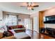 Comfortable living room featuring wood floors, and a gray sectional sofa at 535 Lost Valley Pt, Castle Rock, CO 80108