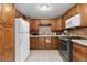 Bright kitchen features wood cabinets, stainless steel oven, and refrigerator at 544 S 3Rd Ave, Brighton, CO 80601