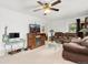 Inviting living room with a fireplace, comfortable seating, and a mounted television at 544 S 3Rd Ave, Brighton, CO 80601
