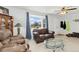 Cozy living room with large window, neutral carpeting, and comfortable seating at 544 S 3Rd Ave, Brighton, CO 80601