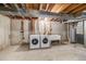 Unfinished basement with utility sink and washer/dryer hookups at 717 Walden Ct, Highlands Ranch, CO 80126