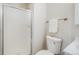 Bathroom showcases a glass-enclosed shower and a white commode at 717 Walden Ct, Highlands Ranch, CO 80126