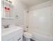 Clean bathroom with tub and shower, and a mirrored medicine cabinet at 717 Walden Ct, Highlands Ranch, CO 80126