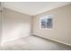 Neutral bedroom with a large window and plenty of open space at 717 Walden Ct, Highlands Ranch, CO 80126