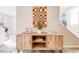 Console table featuring woven wall hanging and interior decorations at 717 Walden Ct, Highlands Ranch, CO 80126