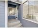 Inviting front entrance with a white door, side windows, and concrete steps at 717 Walden Ct, Highlands Ranch, CO 80126