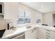 Bright kitchen with white countertop and stainless steel appliances at 717 Walden Ct, Highlands Ranch, CO 80126