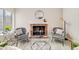 Bright living room showcasing a brick fireplace, modern furniture, and stylish decor at 717 Walden Ct, Highlands Ranch, CO 80126