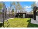 A spacious and well-maintained backyard, with a trampoline and shed that offers fun and functionality at 4895 E Arizona Ave, Denver, CO 80246