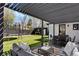 A well maintained backyard with a covered patio, a trampoline, and a storage shed on a sunny day at 4895 E Arizona Ave, Denver, CO 80246