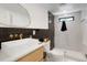 Modern bathroom showcasing a vessel sink, black tile shower, and stylish fixtures at 4895 E Arizona Ave, Denver, CO 80246