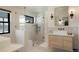 Luxurious bathroom featuring a glass-enclosed shower and modern vanity at 4895 E Arizona Ave, Denver, CO 80246