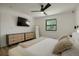 Clean bedroom with a full-length mirror and modern dresser storage at 4895 E Arizona Ave, Denver, CO 80246