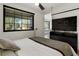 Bedroom featuring large window, closet and wood-look flooring at 4895 E Arizona Ave, Denver, CO 80246