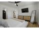 Bedroom featuring neutral colors, modern furniture, and an ensuite bathroom view at 4895 E Arizona Ave, Denver, CO 80246