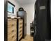 Organized closet featuring custom storage solutions and natural light at 4895 E Arizona Ave, Denver, CO 80246