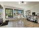 Bright dining area featuring black frame windows with neighborhood views, and a display shelf at 4895 E Arizona Ave, Denver, CO 80246