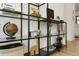 Stylish display shelf with decorative items and a modern design, adding character to the living space at 4895 E Arizona Ave, Denver, CO 80246