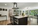 Spacious kitchen island with stainless steel appliances and eat-in dining at 4895 E Arizona Ave, Denver, CO 80246