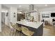 Modern kitchen island with bar seating, sleek appliances, and ample countertop space at 4895 E Arizona Ave, Denver, CO 80246