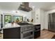 Open kitchen design featuring modern appliances and a large island, perfect for entertaining at 4895 E Arizona Ave, Denver, CO 80246