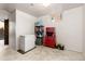 Finished basement featuring tile flooring, a freezer, shelving, and tool storage at 2434 S Ogden St # 2434-2436, Denver, CO 80210