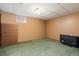 The spacious basement has a window and carpeted floors at 2434 S Ogden St # 2434-2436, Denver, CO 80210