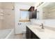 Bathroom featuring a bathtub, vanity with sink, and natural light from the window at 2434 S Ogden St # 2434-2436, Denver, CO 80210