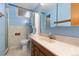 Bathroom with blue walls, marble countertops, and stylish vanity at 2434 S Ogden St # 2434-2436, Denver, CO 80210