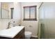 Bright bathroom featuring a shower, a sink with vanity and modern fixtures at 2434 S Ogden St # 2434-2436, Denver, CO 80210