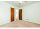 Bedroom showcasing neutral walls, carpet, a ceiling fan, and an open doorway at 2434 S Ogden St # 2434-2436, Denver, CO 80210
