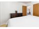 Comfortable bedroom featuring hardwood floors, a dresser and neutral paint at 2434 S Ogden St # 2434-2436, Denver, CO 80210
